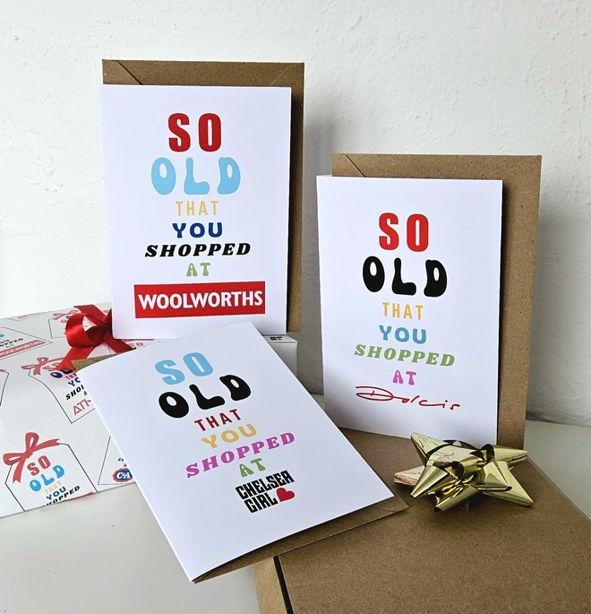 A photograph of 3 cards they say so old that you shopped at Woolworths Chelsea Girl and Dolcis