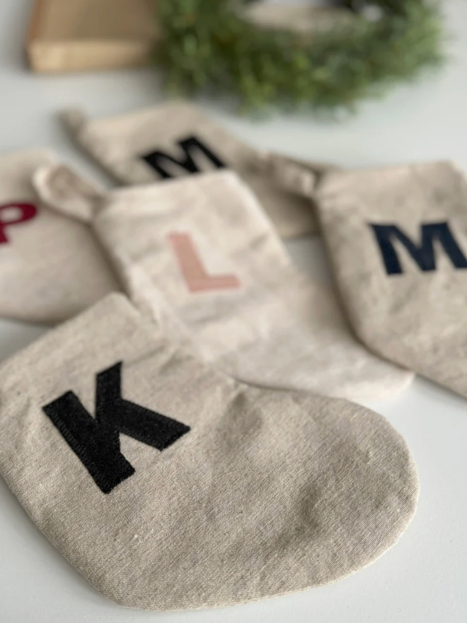 Stocking with Linen Initial. A selection of stockings with letters of various colours.