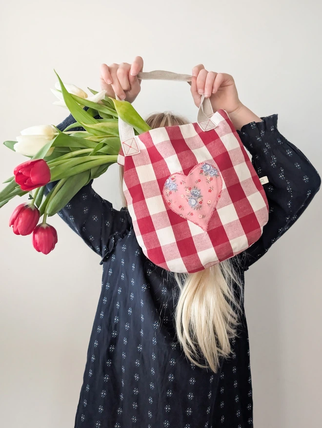 Little girl with Her Valentines Day Heart Bag