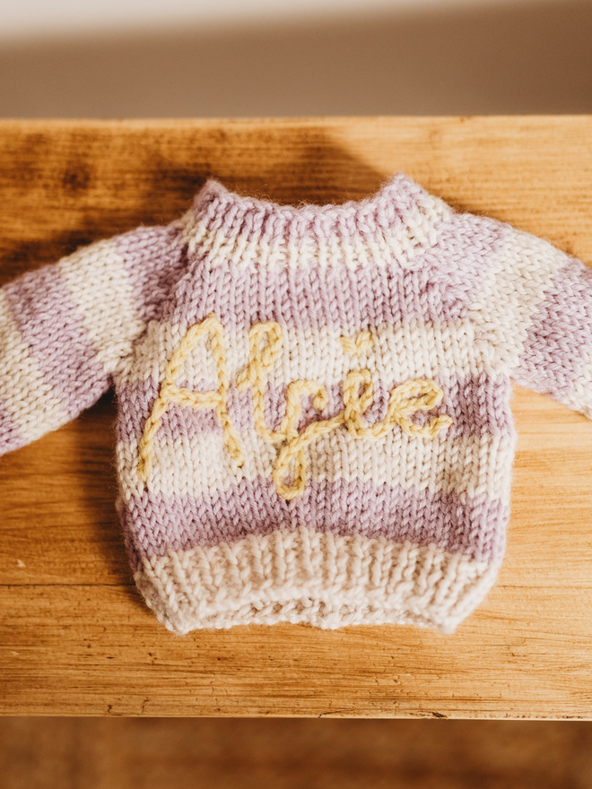 hand knit purple and white striped personalised jumper close up