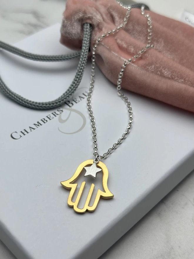 gold hamsa hand charm and sterling silver mini star with sterling silver chain