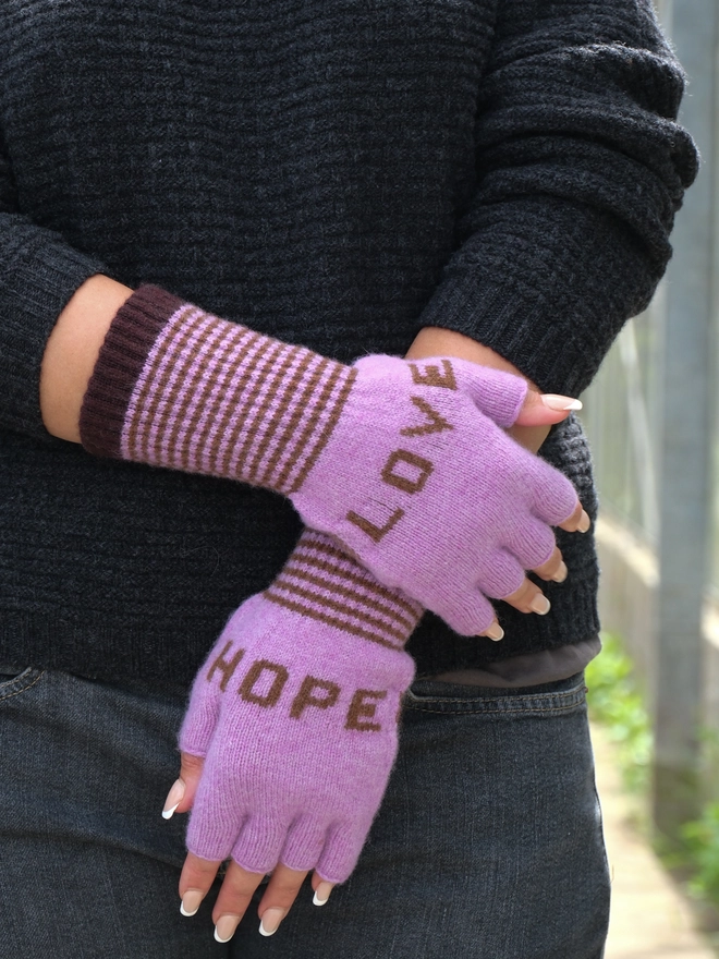 DUSTY LILAC FINGERLESS GLOVES WITH CHOCOLATE BROWN WORDS LOVE AND HOPE AND A STRIPED CUFF GREAT FOR TYPING AND PHONE USE 