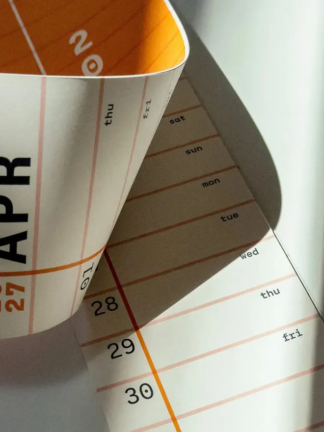 Squared: 2027 Monthly Wall Calendar, on a table, showing a detail of the month