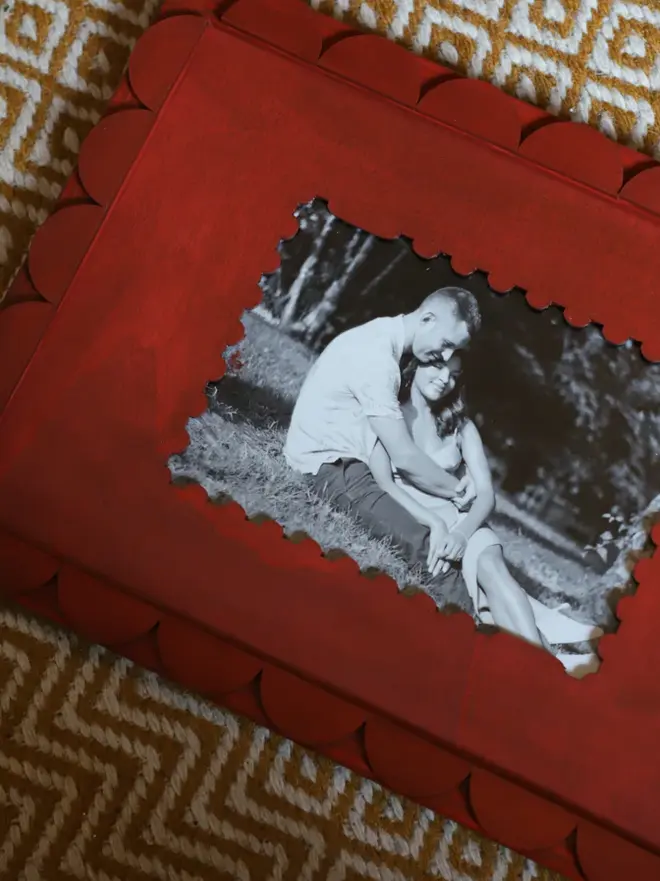 red coloured stamp-shaped mount