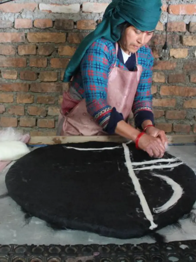 Artisan making a felt cat cave