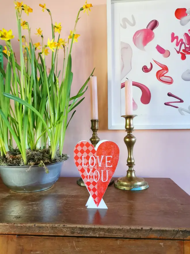 heart shaped red card with 'love you' text