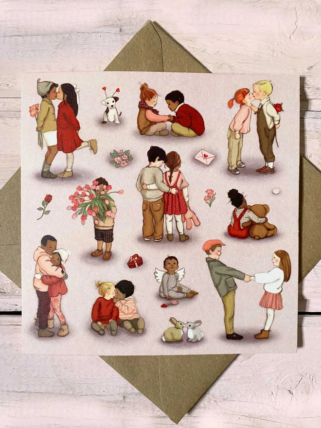 a pretty pink greeting card featuring vintage story book style illustrations of small children enjoying valentines day