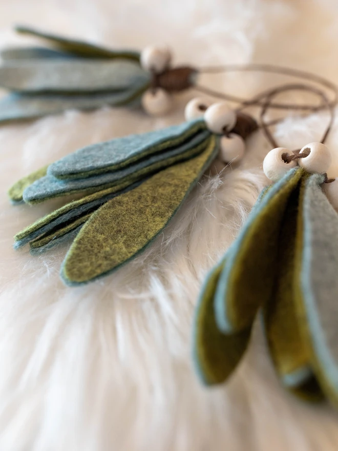 felt mistletoe decorations with white wooden beads