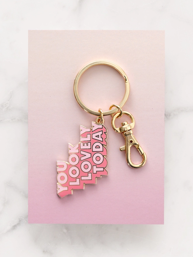 Pink enamel keyring with 'You Look Lovely Today' design