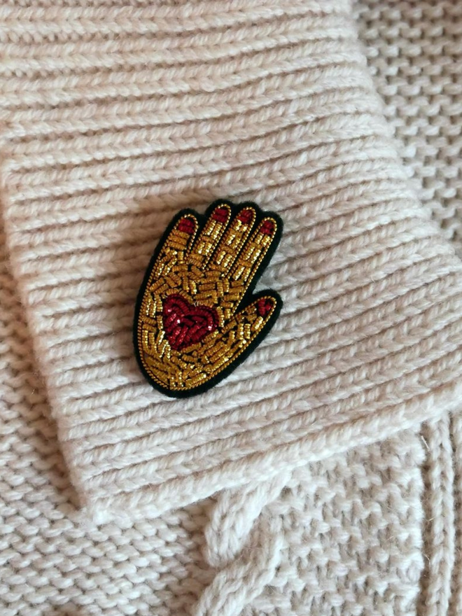 Hand on heart brooch