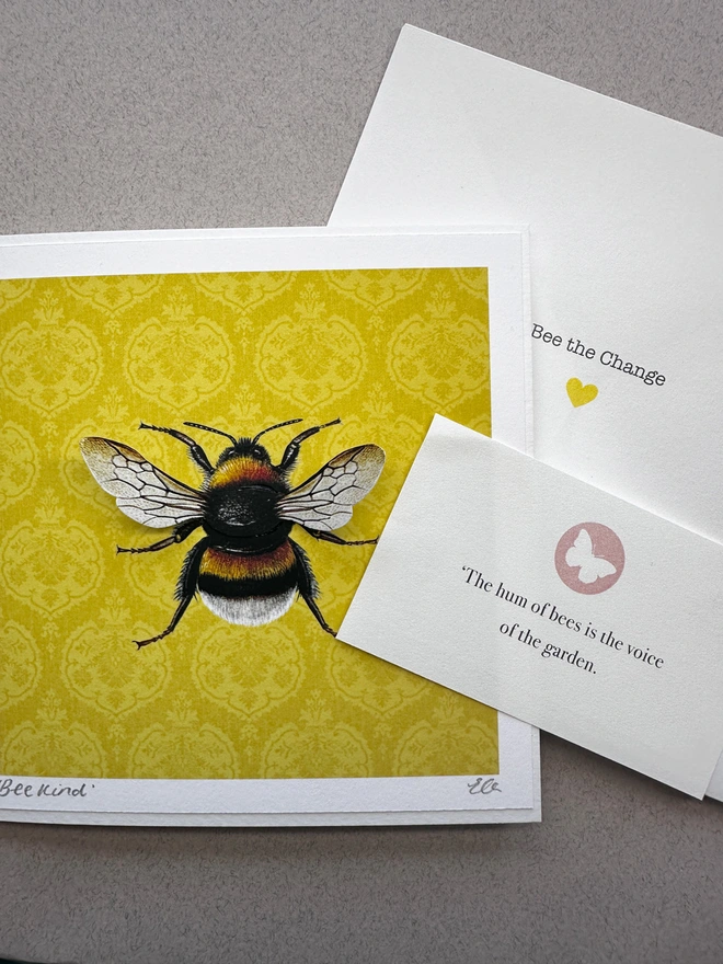 Bumblee card with a bee quote and an envelope on a plain grey background.