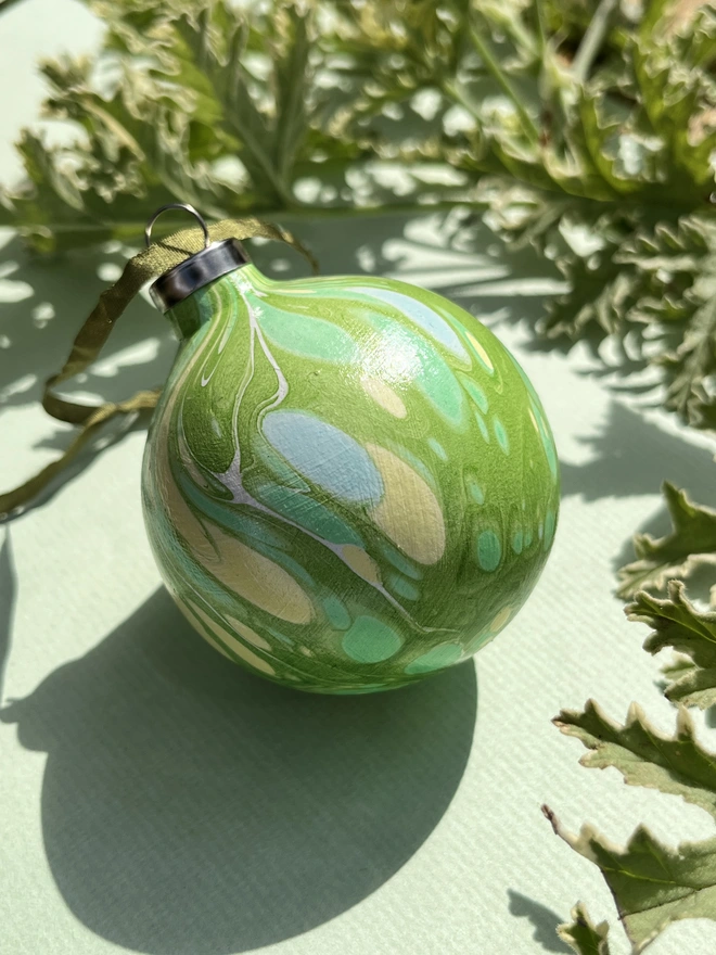 Hand-marbled round ceramic Christmas bauble