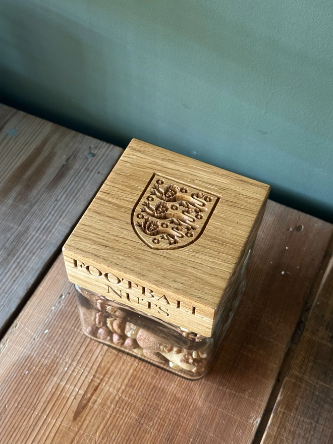 jar with sweets engraved with football nuts and the three lions crest