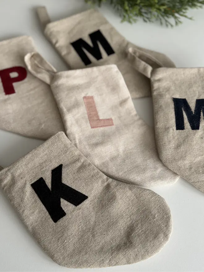 Stocking with Linen Initial. A selection of linen stockings with multicoloured initials.
