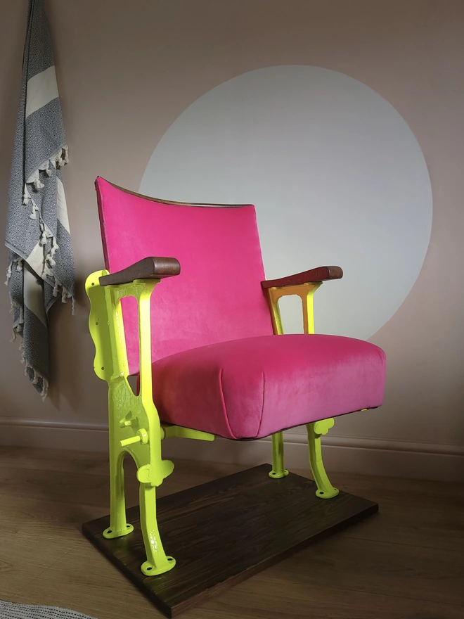 Orange Otter cinema seat in hot pink with bright yellow legs