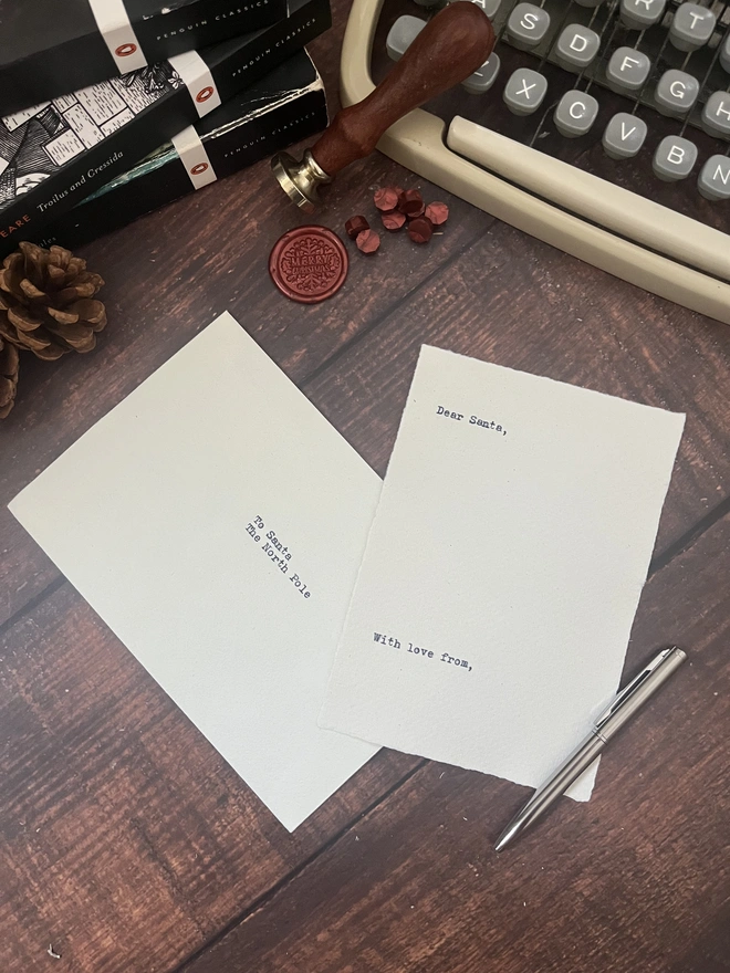 letter to santa, hand typed onto handmade cotton rag paper using an antique typewriter with a merry christmas red wax seal and envelope. 