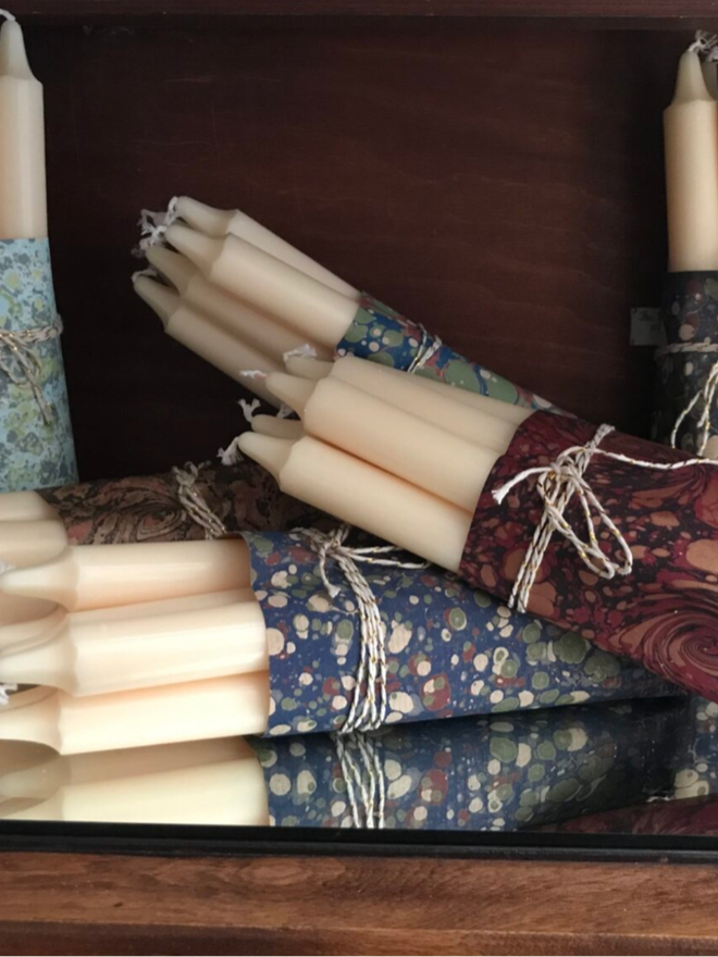 Wrapped Candles. A selection of candles wrapped in different papers.