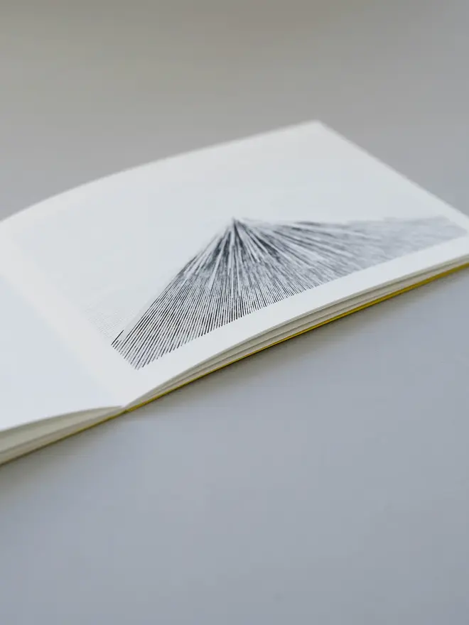 Mountain Book, positioned open on a table