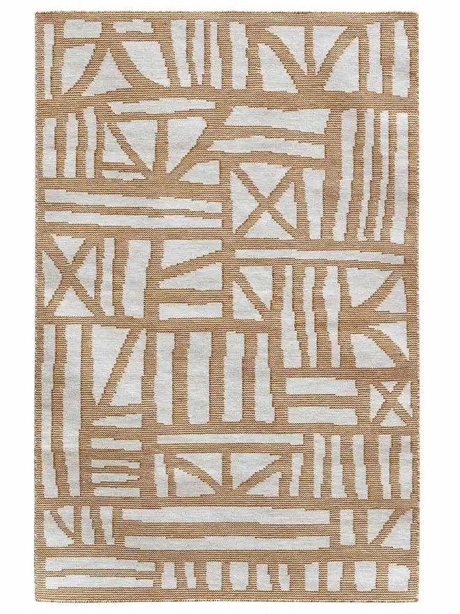 Tudor Flatweave Rug, a colourful rug on a white surface. 