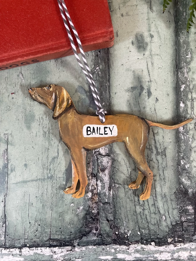 A Vizsla Christmas decoration with grey twine and the name " BAILEY" added