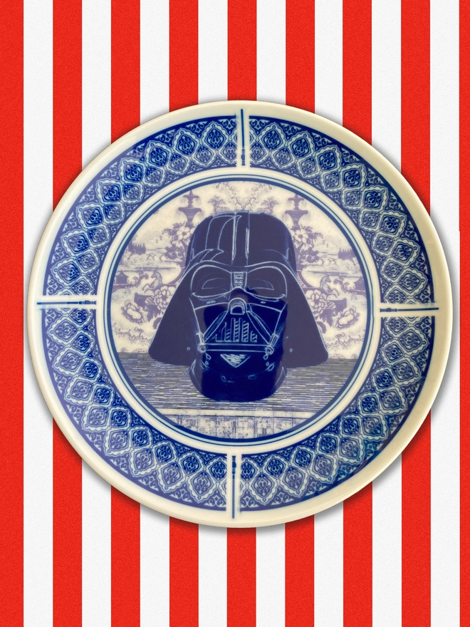 Blue and white Delft style plate featuring the head of Darth Vader in the centre