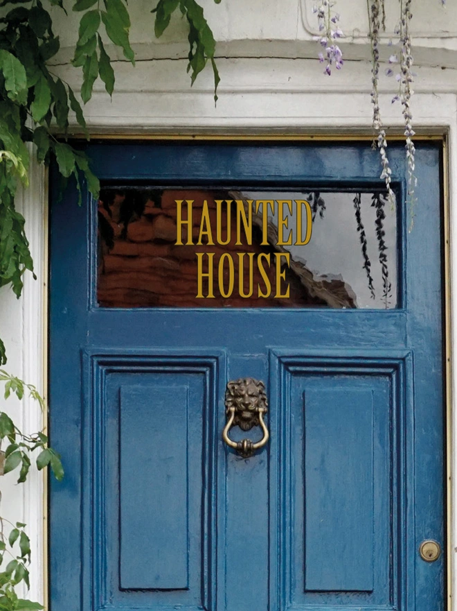 gold and black haunted house wall sticker
