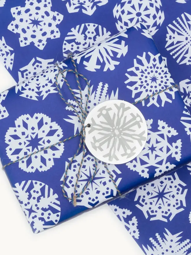 blue wrapping paper with white snowflaked