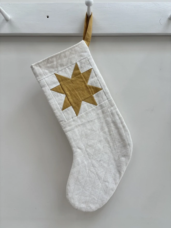 Medium Quilted Linen Star Christmas Stocking in White Linen with Yellow Linen Patchwork Star Design.