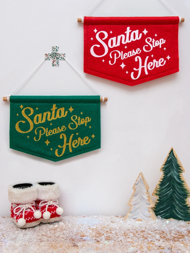 felt "Santa please stop here" banners in red and white or green and gold.