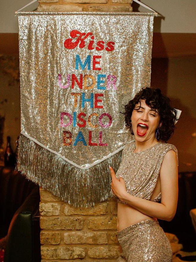 Kiss me under the disco ball banner