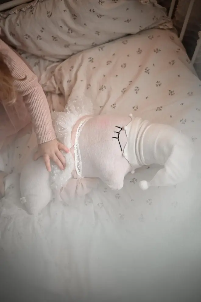 Sleepy Moon Nursery Pillow Hanging Decoration, a hanging pillow decoration suspended in a bedroom. 