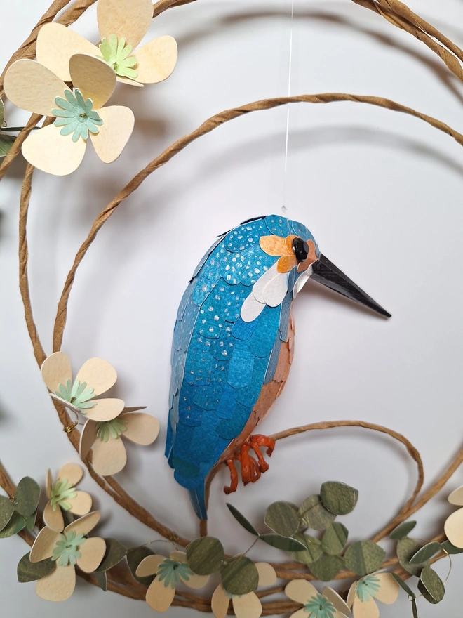 back view of a paper sculpture of a kingfisher