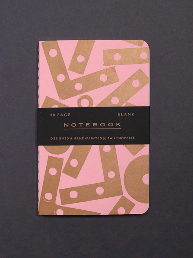 Blank Angle Notebook. A notebook in pastel pink