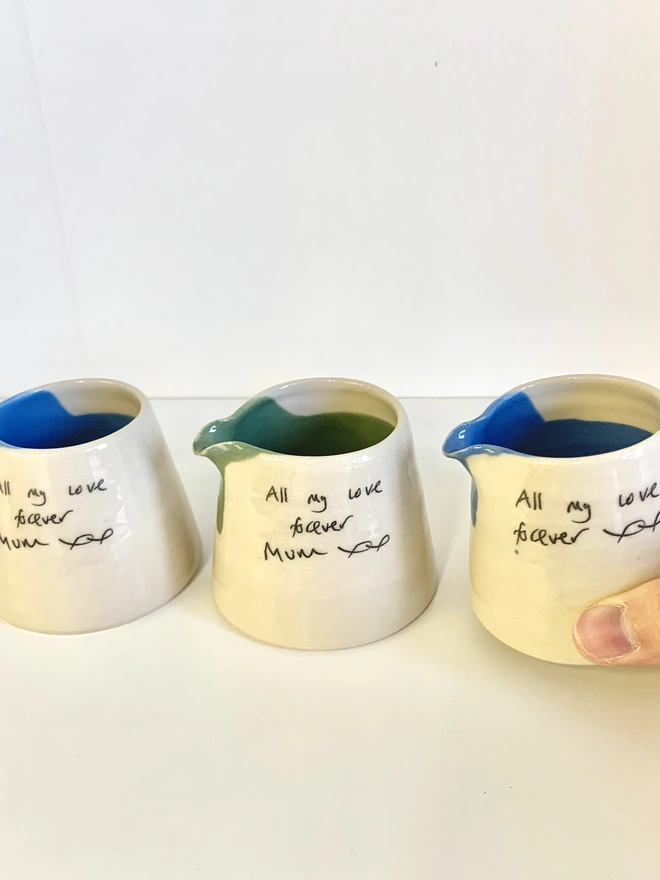 a set of 3 personalised mini ceramic pour jugs