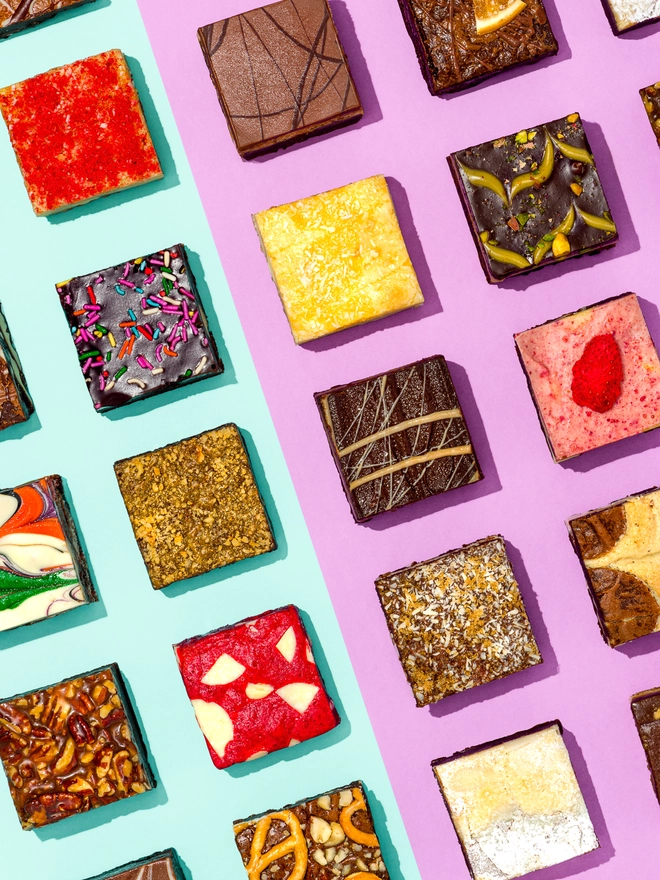 January Brownies Only Selection (Box Of 6, 12, 16 Or 32), a selection of brownies against a colourful backdrop. 