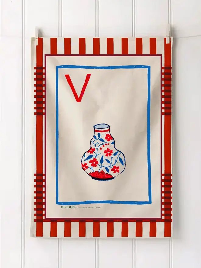 a-z alphabet tea towel. a tea towel with a vase print and the letter 'v' in the corner.