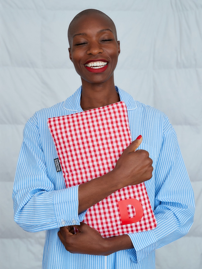 Red gingham hot water bottle with red initial