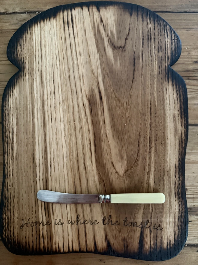 Large  engraved toast board with Home is where the toast is and small vintage butter knife with cream handle
