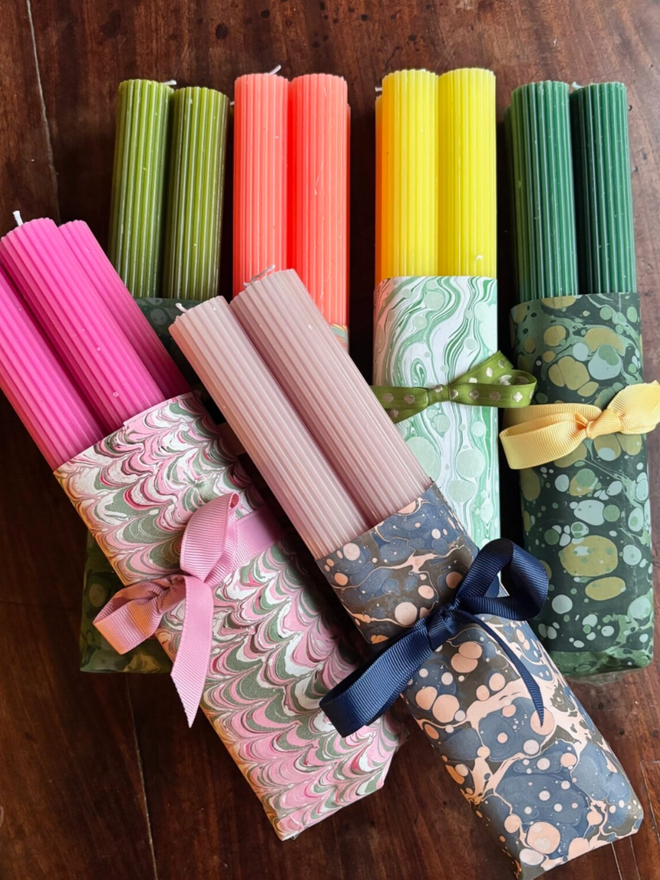 Wrapped Scalloped Dinner Candles. A selection of the different colours of candle available.