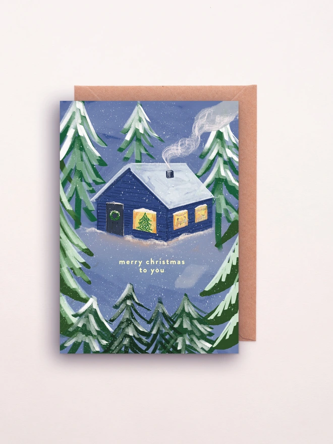 Cosy cabin illustrated Christmas Card