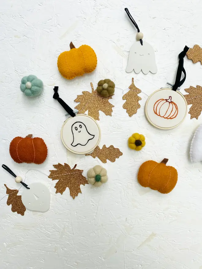 embroidered halloween mini hoop. assorted mini halloween hoops displayed on white background with decorations.