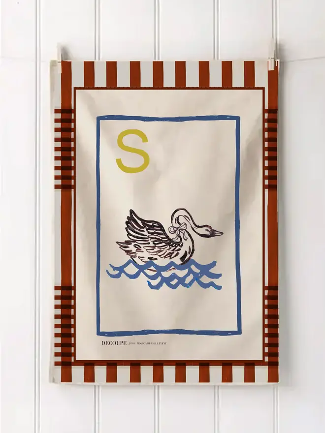a-z alphabet tea towel. a tea towel with a swan print and the letter 'q' in the corner.