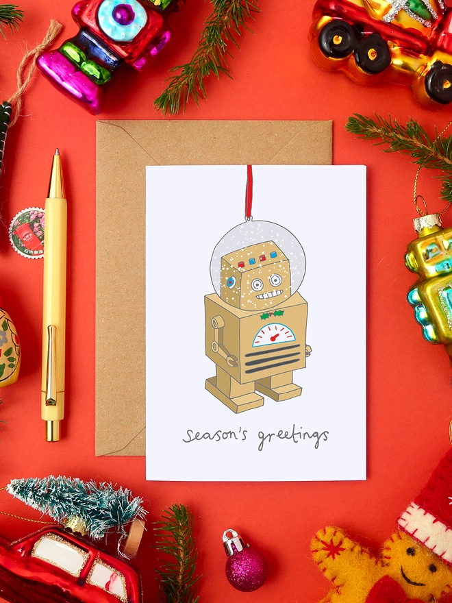 Quirky Christmas Card Featuring a Robot Snow Globe Tree Decoration