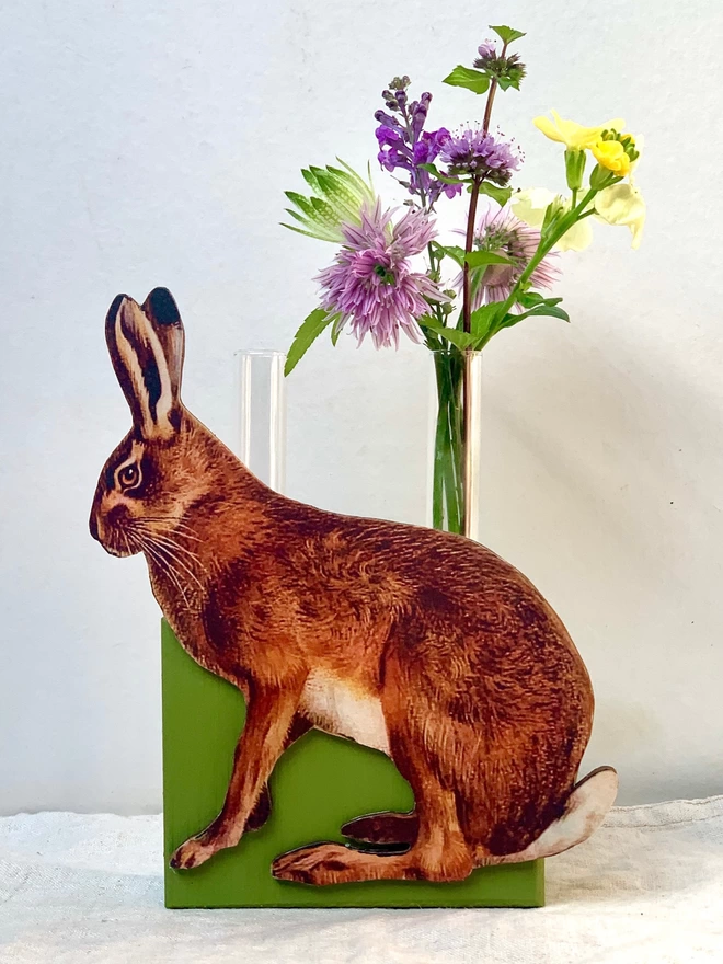 Rabbit vase with test tubes and green painted, recycled wood.