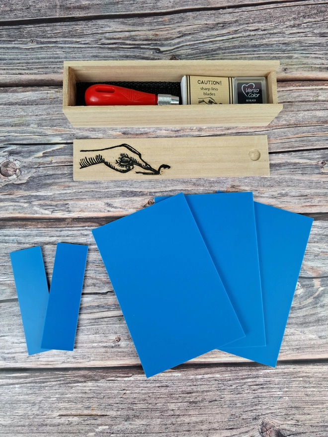 Lino carving and printing kit in wooden box with blue soft lino and versicolor ink pad