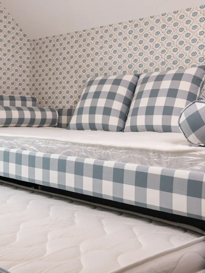 'The Posie' blue gingham upholstered children's bed. a blue gingham sofa-style bed for children.