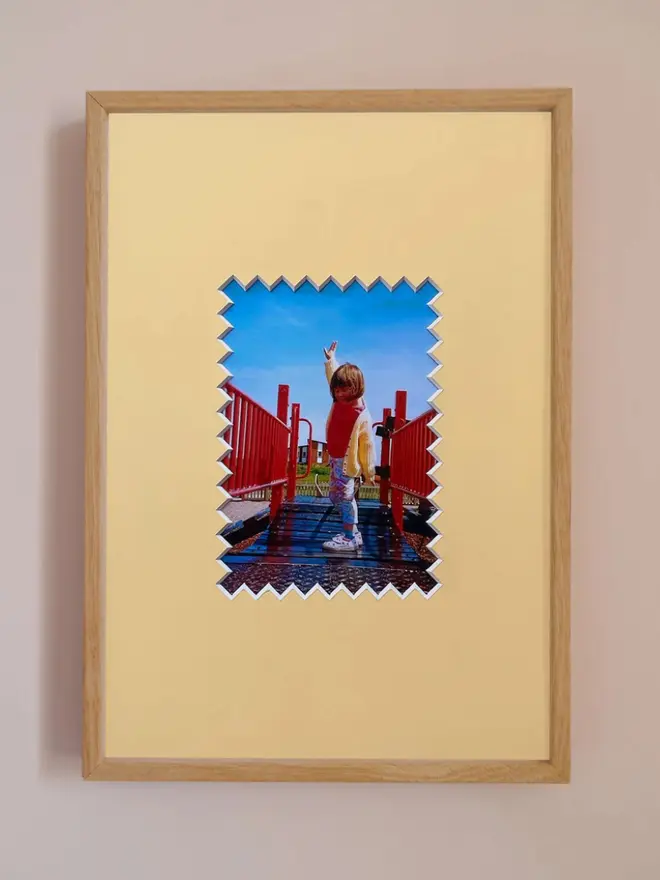 Ziggy photo mount frame ,displaying a centered portrait photo, hung on a neutral beige wall.