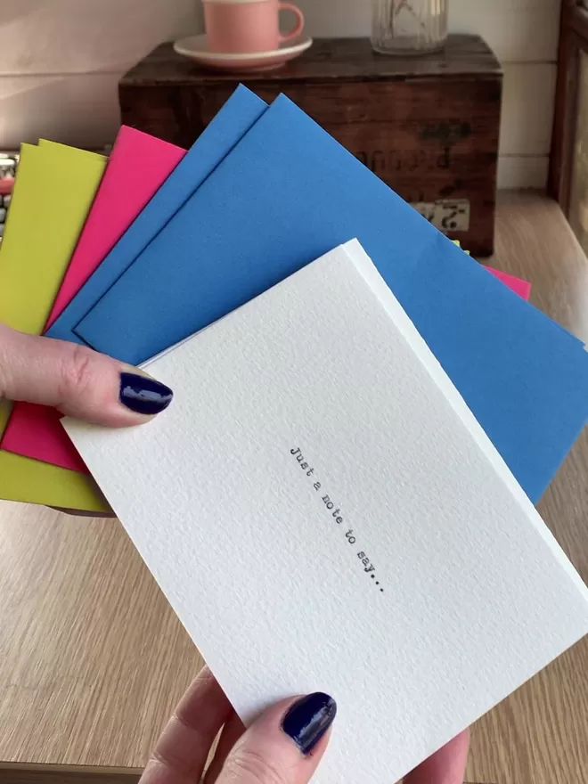 Brightly coloured envelopes and personalised notecards
