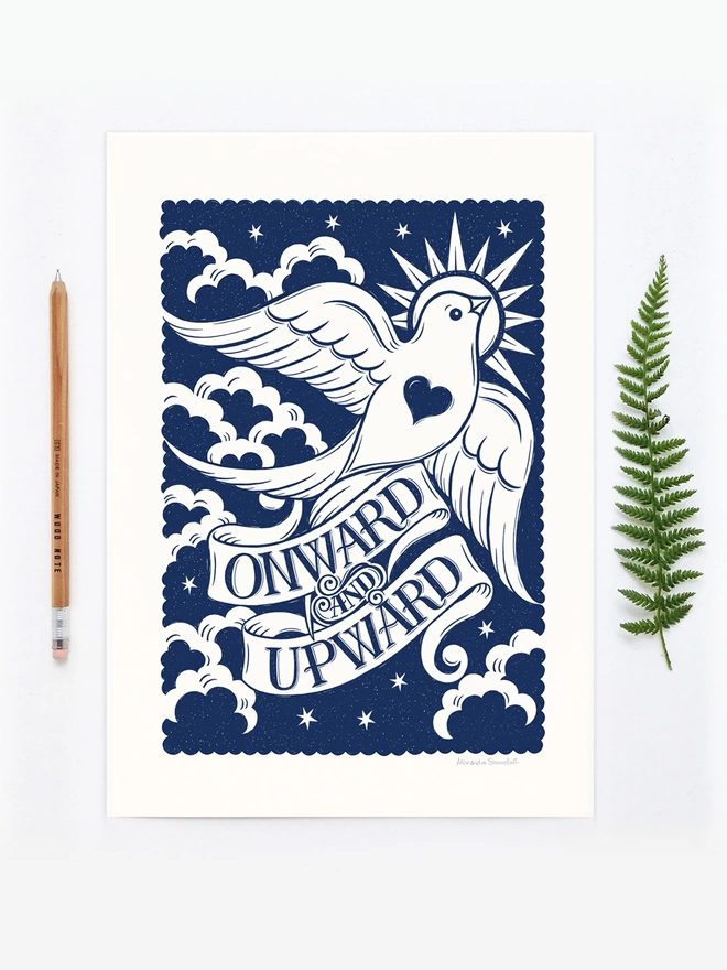 blue and white onward and upward print with wood pencil and fern