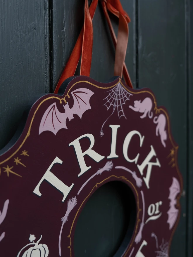 Purple and lilac Halloween Wreath with cat, bat and cobweb details and gold line work